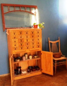 An old library card catalog now serves as display space for hand thrown pottery and goat's milk soap.